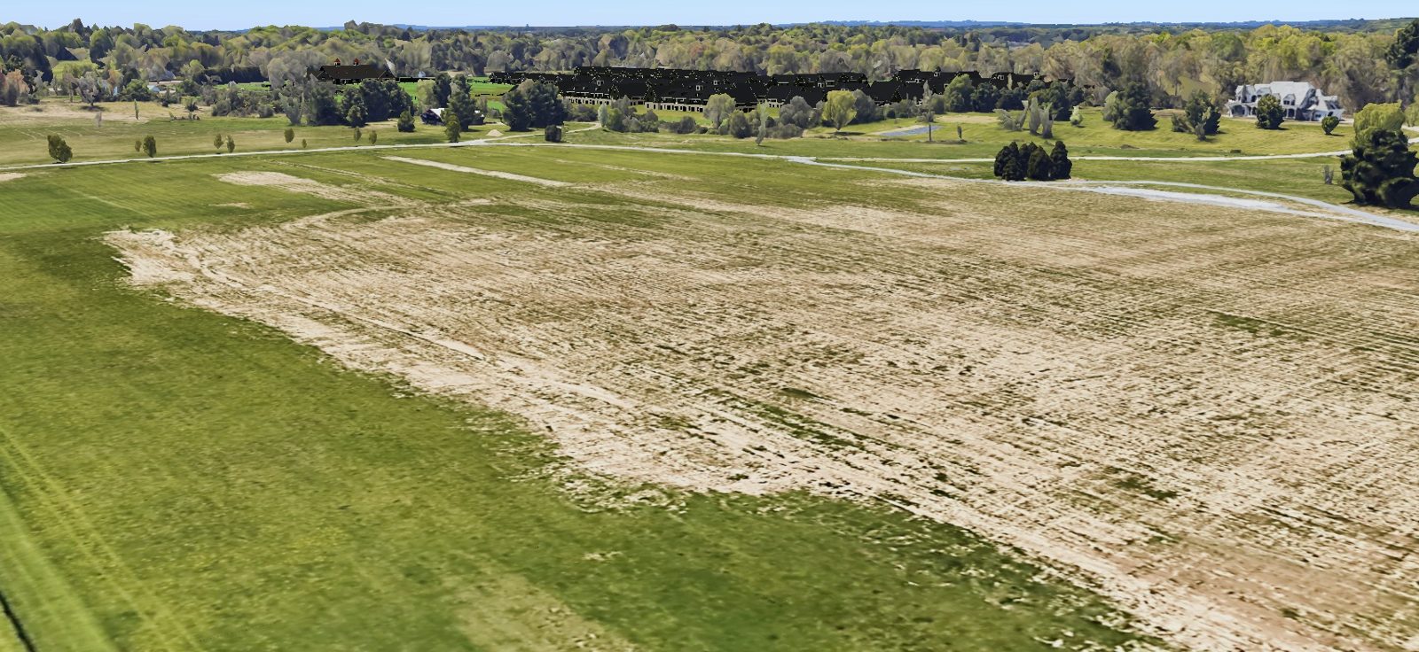 Geolocated rendering from Bloomfield Road showing the proposed buildings above the field